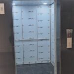 Clean and spacious elevator lobby with high-speed commercial lifts in an office building for rent in Okhla Phase 2.
