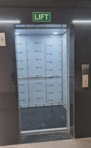 Clean and spacious elevator lobby with high-speed commercial lifts in an office building for rent in Okhla Phase 2.
