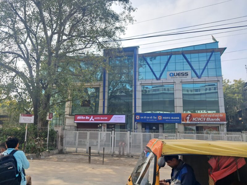 Modern commercial office building lift lobby and fire safety equipment in Okhla.