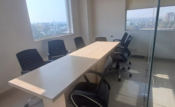 Modern multi-purpose meeting and collaboration room inside a flexible lease office space in Okhla.