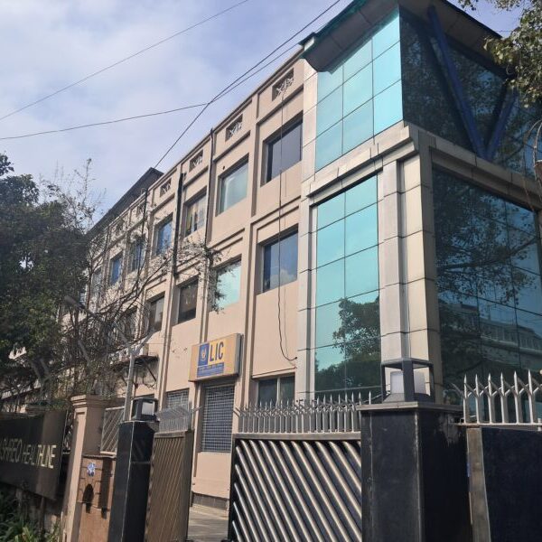 Modern commercial office building exterior with structured signage and entrance in Okhla Phase 3 Delhi.