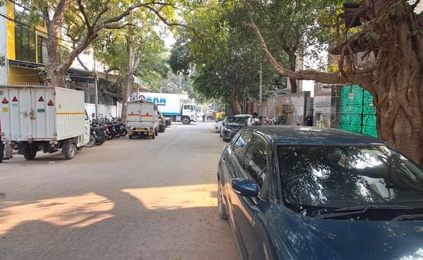 Secure compound with dedicated vehicle parking and loading space in Okhla Phase 2 commercial property.