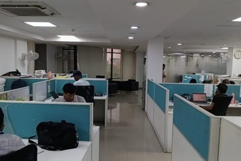 Modern commercial property exterior facade with wide entry and parking in Okhla Phase 3 Delhi.