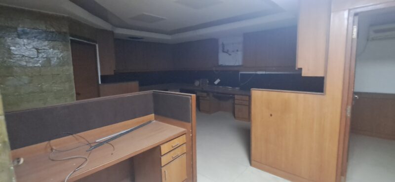 Cluster of ergonomic desks and chairs inside a small furnished office space in Okhla Phase 3