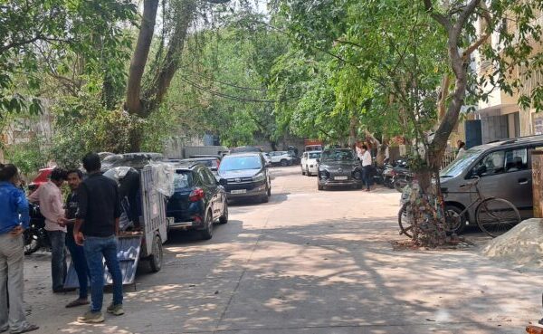 Paved vehicular parking and loading yard outside a DDA shed commercial property in Okhla Phase 2.