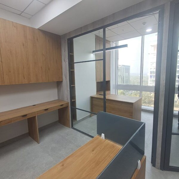 Premium furnished corporate office space interior with workstations in DLF Prime Towers Okhla Delhi.