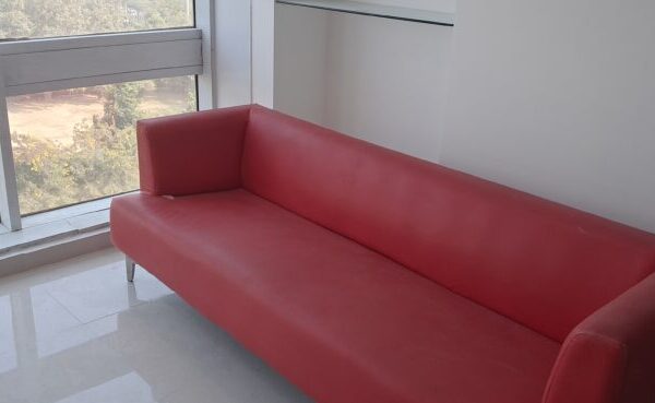Modern breakout and informal networking lounge inside a commercial rental office in Okhla.