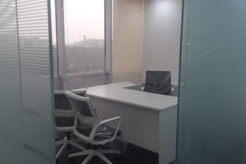 Glass-partitioned executive manager cabin and meeting area in FIEE Complex Okhla Phase 2.