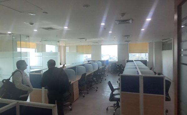 Open-plan modular office layout with adaptable desks inside a flexible lease commercial property in Okhla.
