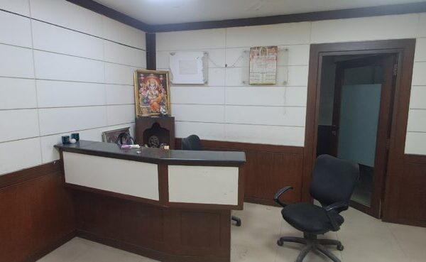 Premium corporate reception desk and waiting lounge inside a furnished office space for lease in Okhla.