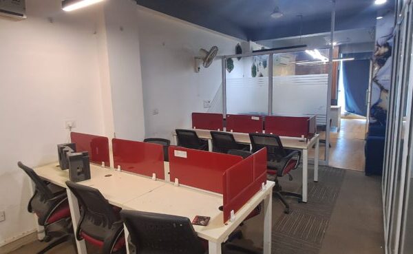 Spacious high-ceiling open floor plate inside a DDA shed office for rent in Okhla Phase 2.