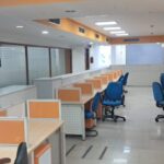 Large column-free commercial office hall with ample natural lighting in Okhla Phase 3 Delhi.
