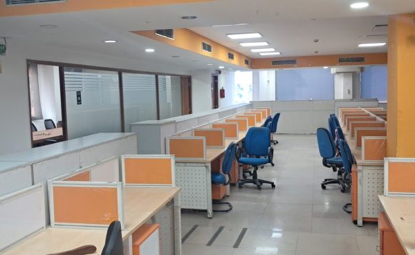 Large column-free commercial office hall with ample natural lighting in Okhla Phase 3 Delhi.