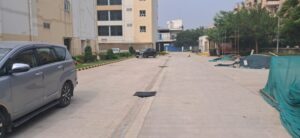 Gated commercial parking area with 24/7 security guard monitoring in Okhla Phase 2.